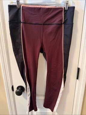 Athleta women’s cropped Burgundy and Black Athletic Leggings with Pink Trim
